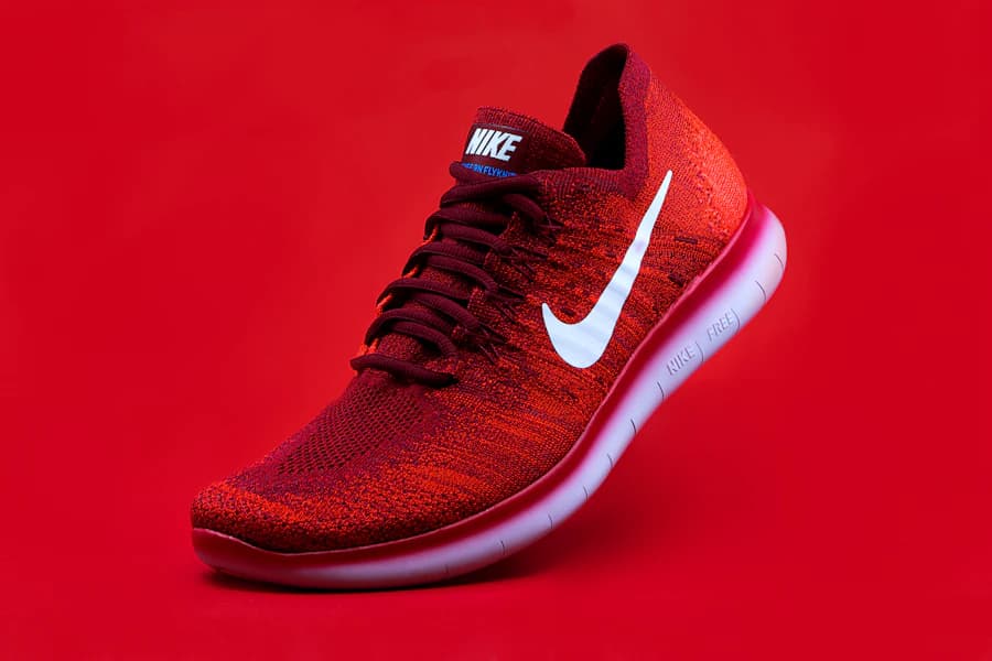 Product campaign still, shot on a bold red backdrop